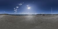 a fisheye lens panoramic view of a boat and pier and blue sky