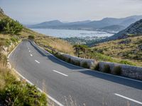 Coastal Highway in Spain: Clear Sky and Ocean View