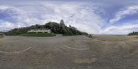 the view of a beach area with a house on it's side from a point of view