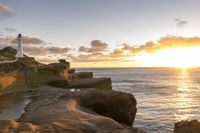 Coastal Landscape at Dawn with Sun Over the Ocean