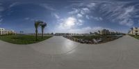 a skateboarder rides along the cement in a park in this view from below