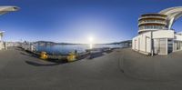 an aquarium - like fish eye panoramic image with buildings and boats on water