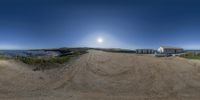 an outdoor photo taken from a fisheye lens of a tractor parked on dirt road