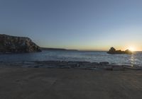 Coastal Landscape of Portugal: Sun Visible Over the Water