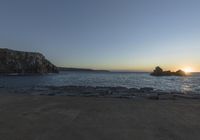 Coastal Landscape of Portugal: Sun Visible Over the Water