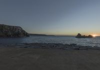 Coastal Landscape of Portugal: Sun Visible Over the Water