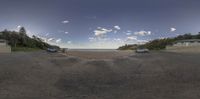 two cars parked at the end of the road next to each other and on a beach