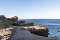 a long exposure photo of an outdoor beach area near the water on a sunny day