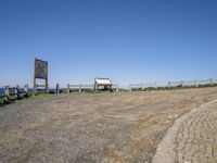 Coastal Parking Lot with a View of Sand and Water