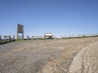 Coastal Parking Lot with a View of Sand and Water