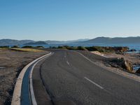 Coastal Plain Road with Clear Sky and Ocean View