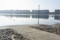 Coastal Reflections: Sand and Clear Skies