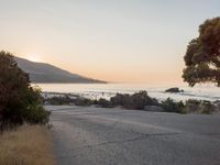 Coastal Road at Dawn: Leading to a Sandy Beach