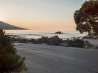 Coastal Road at Dawn: Leading to a Sandy Beach