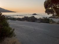 Coastal Road at Dawn: Leading to a Sandy Beach
