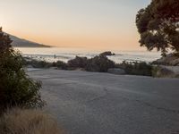 Coastal Road at Dawn: Leading to a Sandy Beach