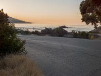 Coastal Road at Dawn: Leading to a Sandy Beach