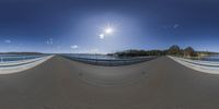 this is an 360 - turn of the street bridge with a blue sky and clouds overhead