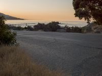 Coastal Road at Dawn: Low Sunlight Illuminates the Landscape
