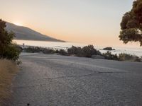 Coastal Road at Dawn: Low Sunlight Illuminates the Landscape