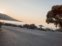 Coastal Road at Dawn: Low Sunlight Illuminates the Landscape
