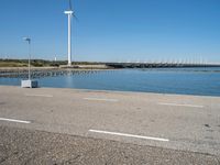 Coastal Road in Holland with Azure Ocean and Windmills