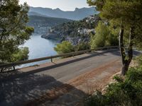 the view down the road to a small village near the water in italy - ©iw