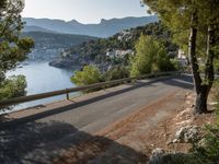 the view down the road to a small village near the water in italy - ©iw