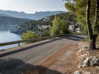 the view down the road to a small village near the water in italy - ©iw