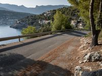 the view down the road to a small village near the water in italy - ©iw