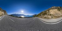 the sun shines bright as the mountains pass by in this distorted image of the roads