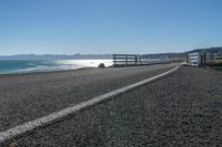 an empty beach is shown in the day time and sunny weather with bright sun shining