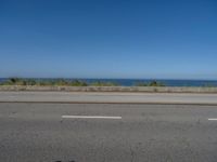 Coastal Road in Porto, Portugal under Clear Skies