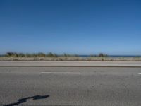 Coastal Road in Porto, Portugal under Clear Skies