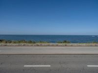 Coastal Road in Porto, Portugal under Clear Skies