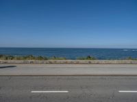 Coastal Road in Porto, Portugal under Clear Skies