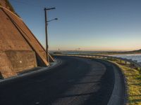 Coastal Road with Yellow Horizon at Dawn