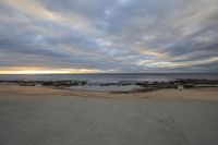 Coastal Sunrise: Beach Horizon with Sun Visible