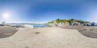 360 - turn view of a small boat dock in a large town by the sea