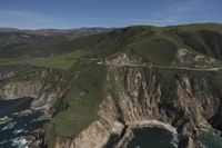 Coastal View: Ocean Cliffs and Contrails