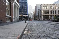 a cobbled path with an orange line on one side, some on the other