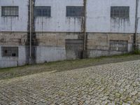 Cobblestone Courtyard in Porto, Portugal: Warehouse View