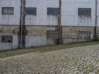 Cobblestone Courtyard in Porto, Portugal: Warehouse View