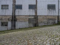 Cobblestone Courtyard in Porto, Portugal: Warehouse View