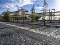 the paved parking lot is empty and ready to be used as a business park area