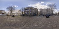 a very pretty fish eye view of some sort of building and street furniture outside by itself