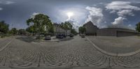 there is a fisheye lens picture of a small city street as seen from the street