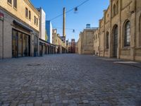 Cobblestone Street in Berlin: Classic Architecture and Hard Shadows