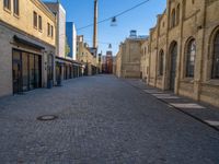 Cobblestone Street in Berlin: Classic Architecture and Hard Shadows