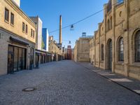 Cobblestone Street in Berlin: Classic Architecture and Hard Shadows